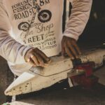man working on model plane
