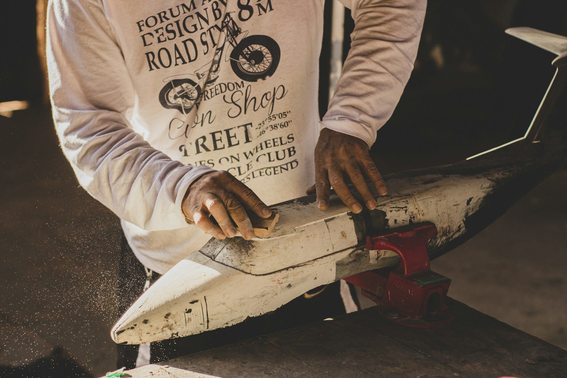 man working on model plane