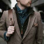 brown blazer man with backpack