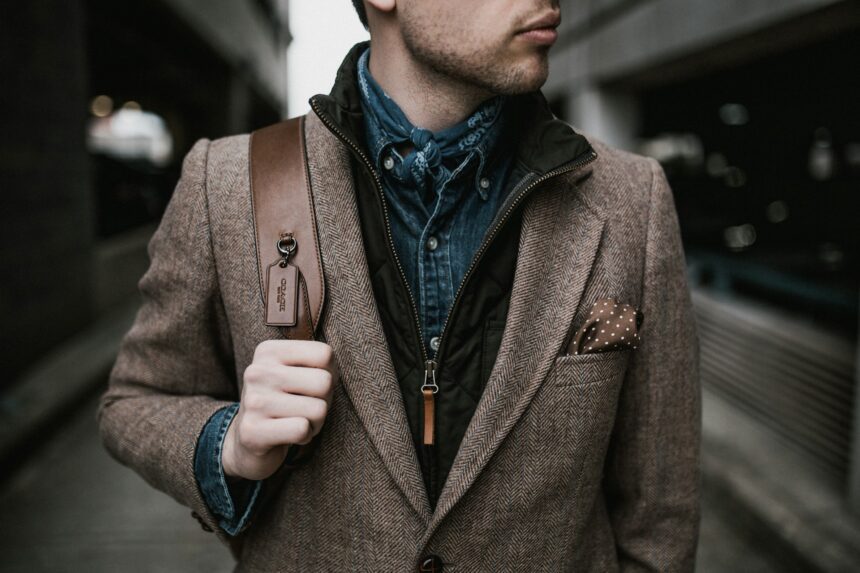 brown blazer man with backpack