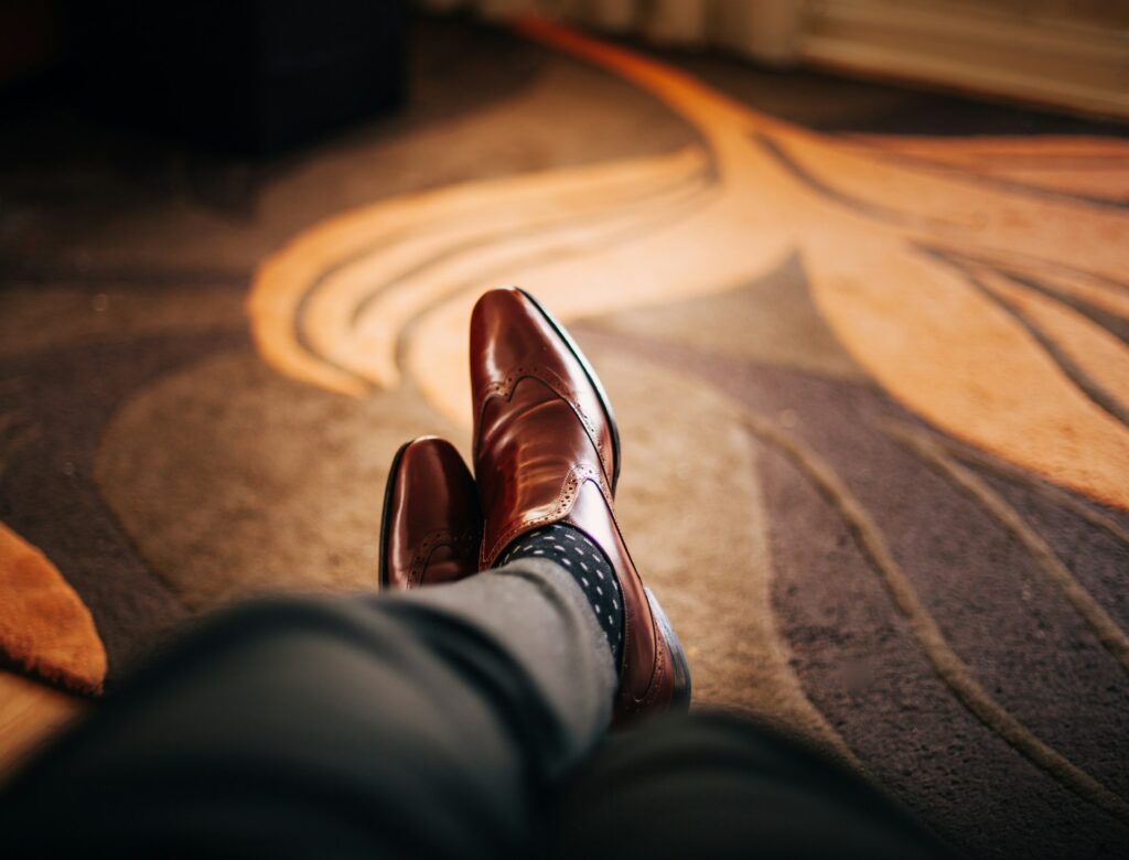 brown shoes on a mans feet