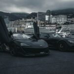 two sports cars at the docks