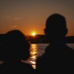 man and woman at sunset