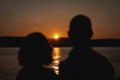 man and woman at sunset