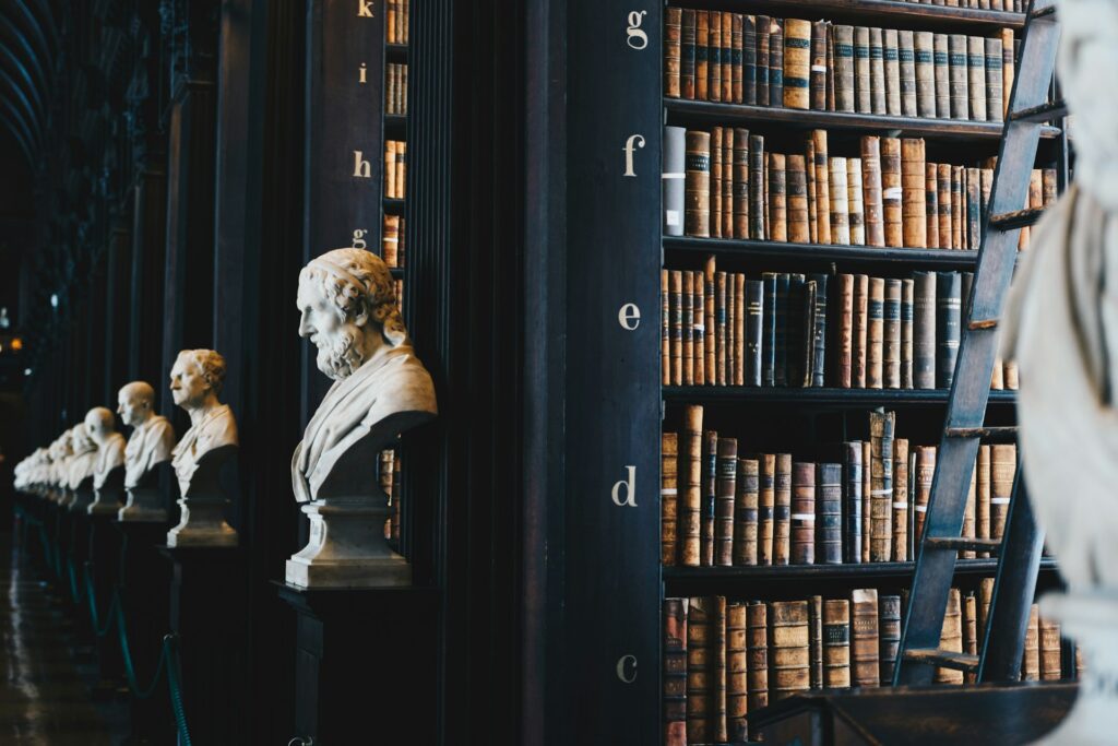 statues lined up in library