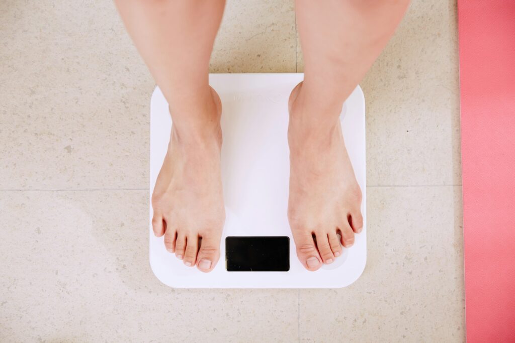 man standing on scales