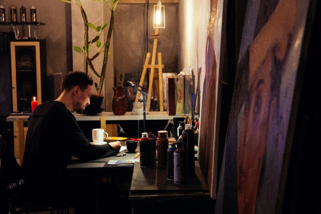 man artist in studio painting