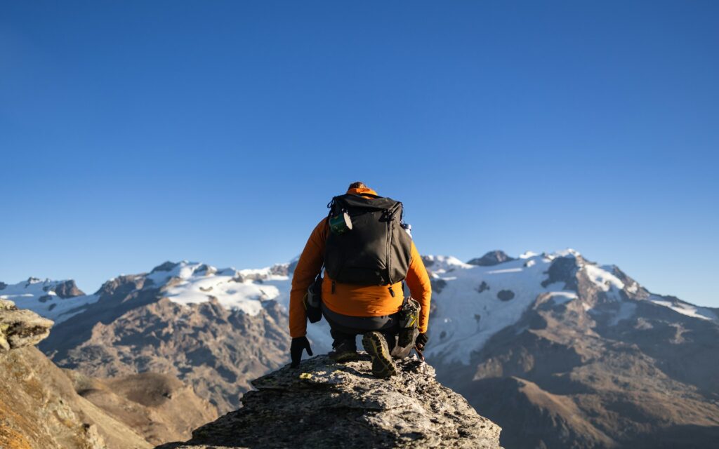 man on top of a mountain