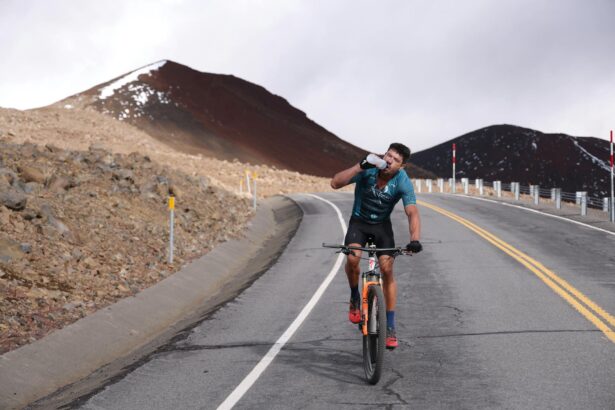 man riding bike hard in mountains