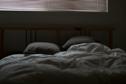 bed in a dark room