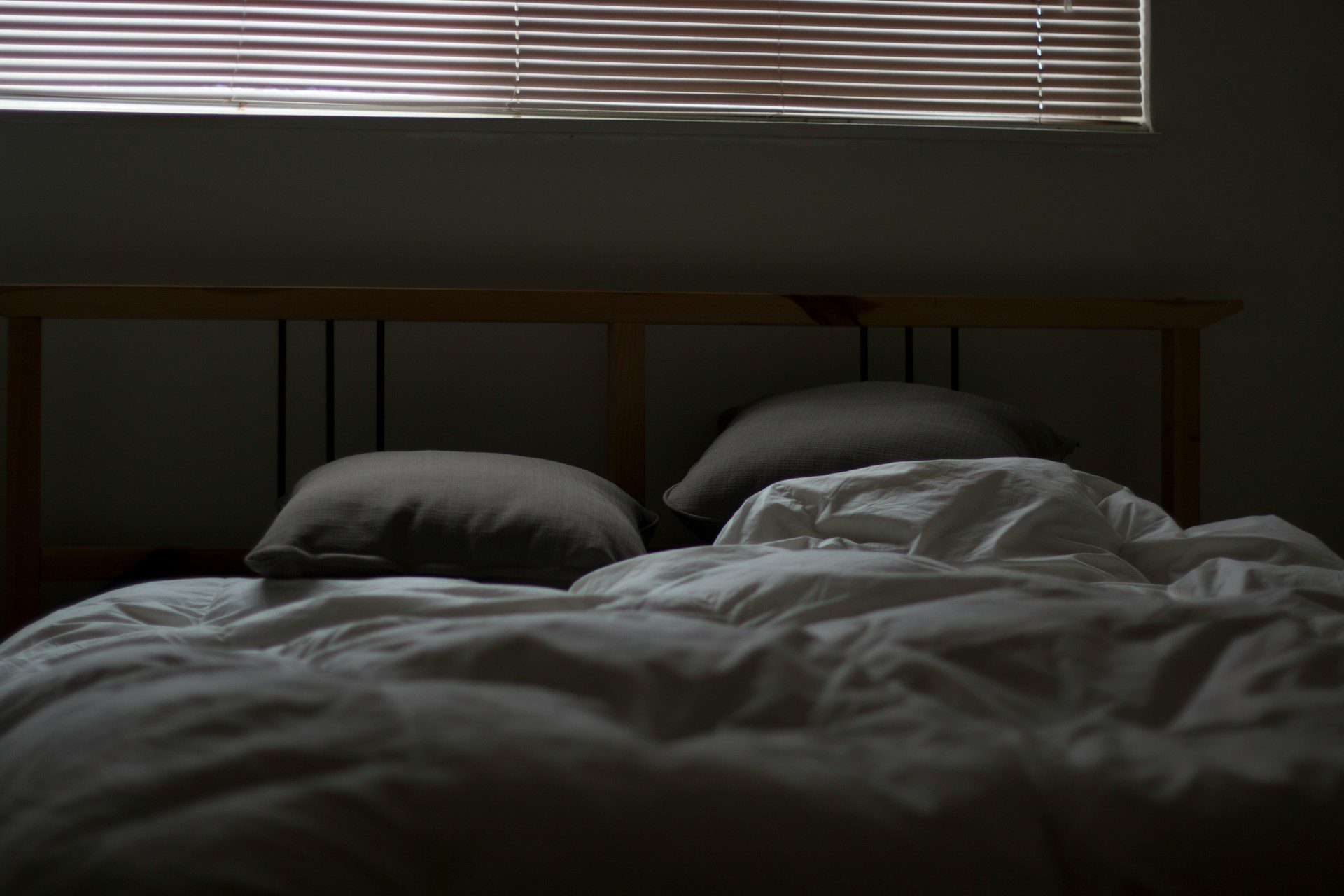 bed in a dark room