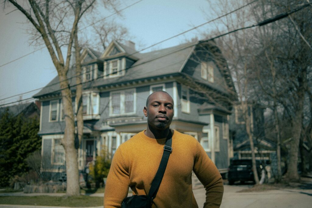 man outside in yellow jacket