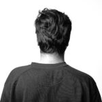 man standing backwards