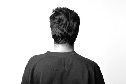 man standing backwards