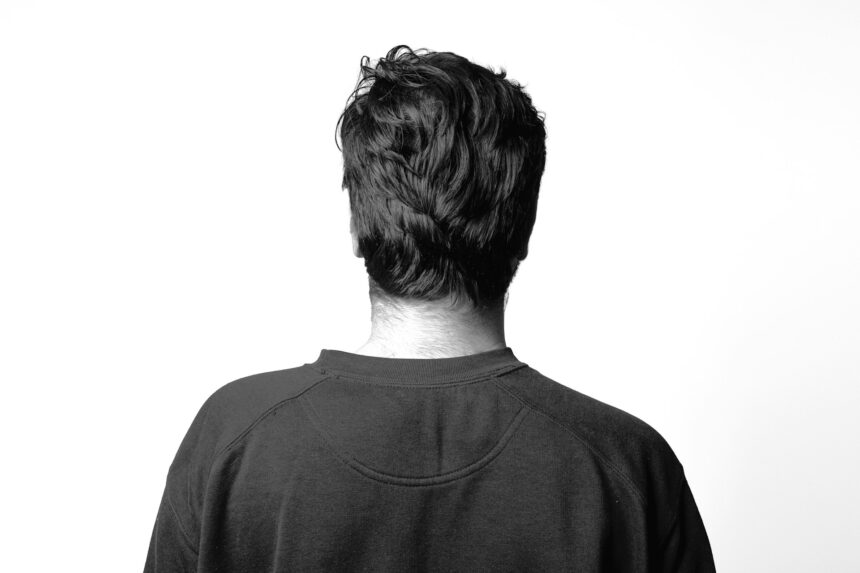 man standing backwards
