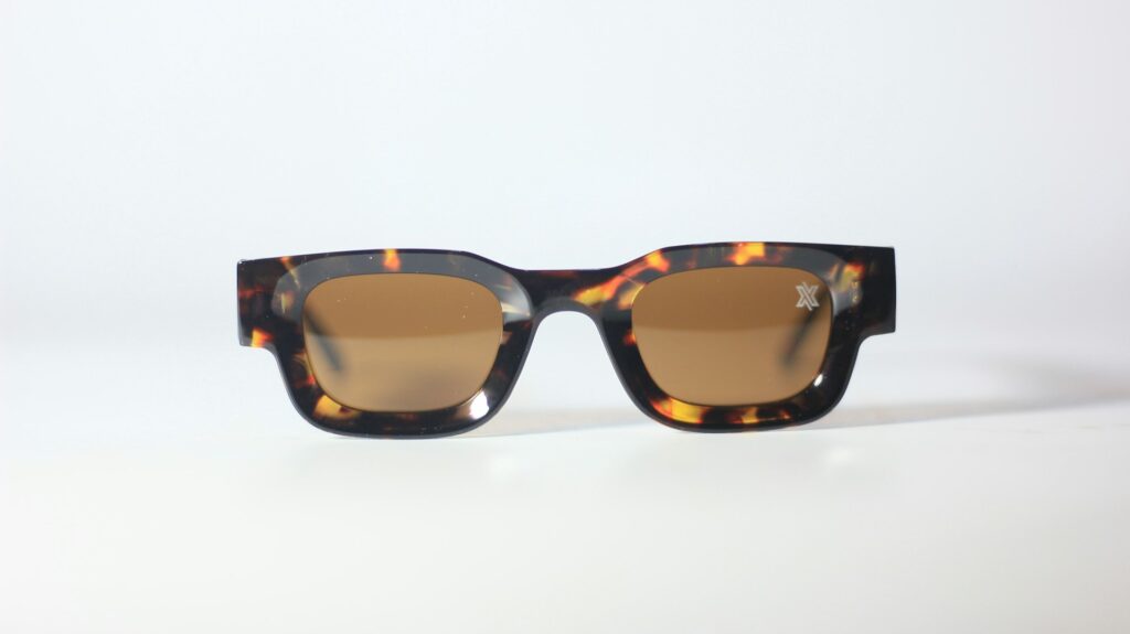 mens sunglasses on table